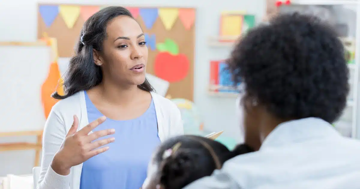 Parent talking with teacher about eczema